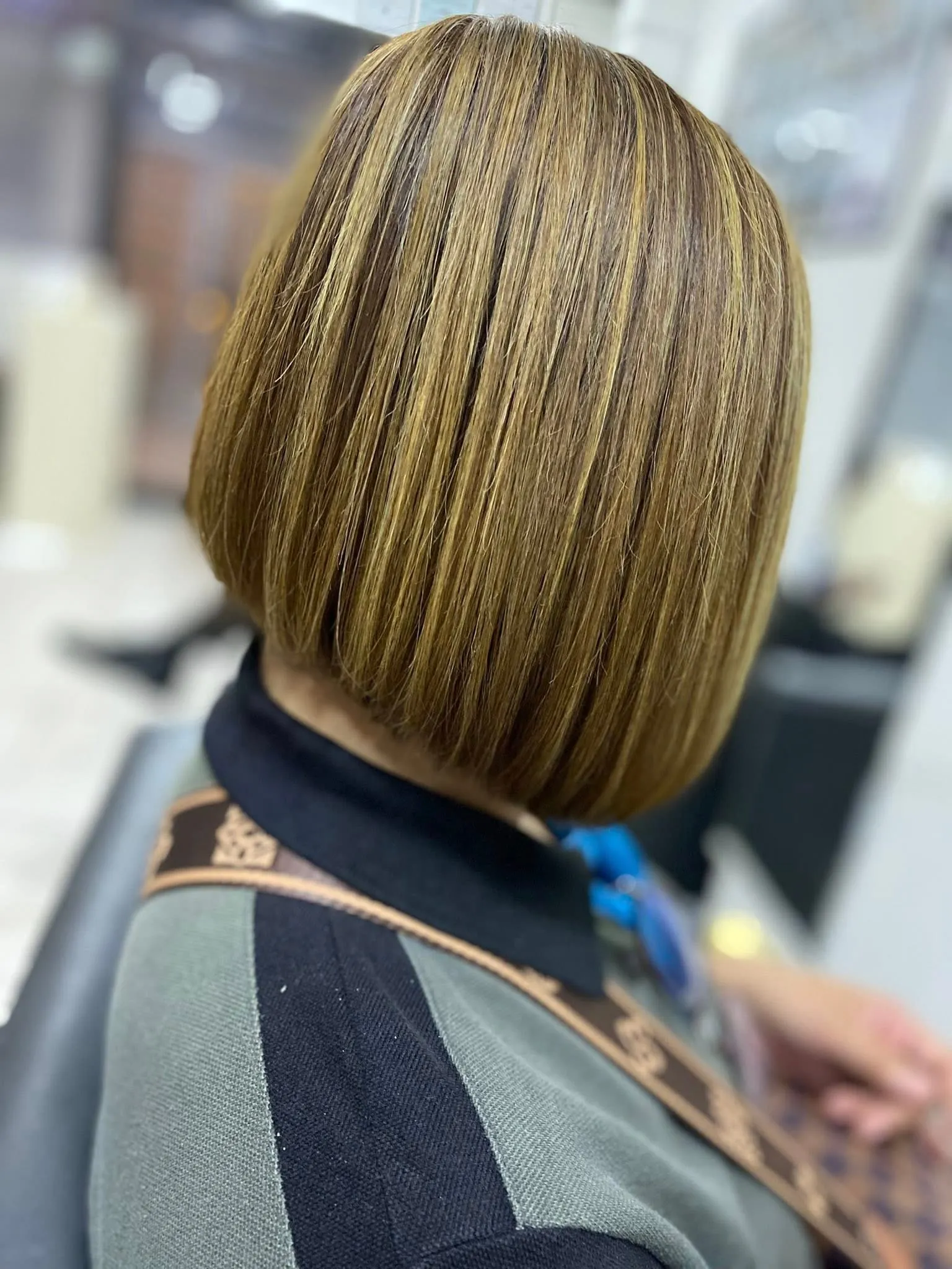 Blonde highlights and layered styling by an Angeles City barber