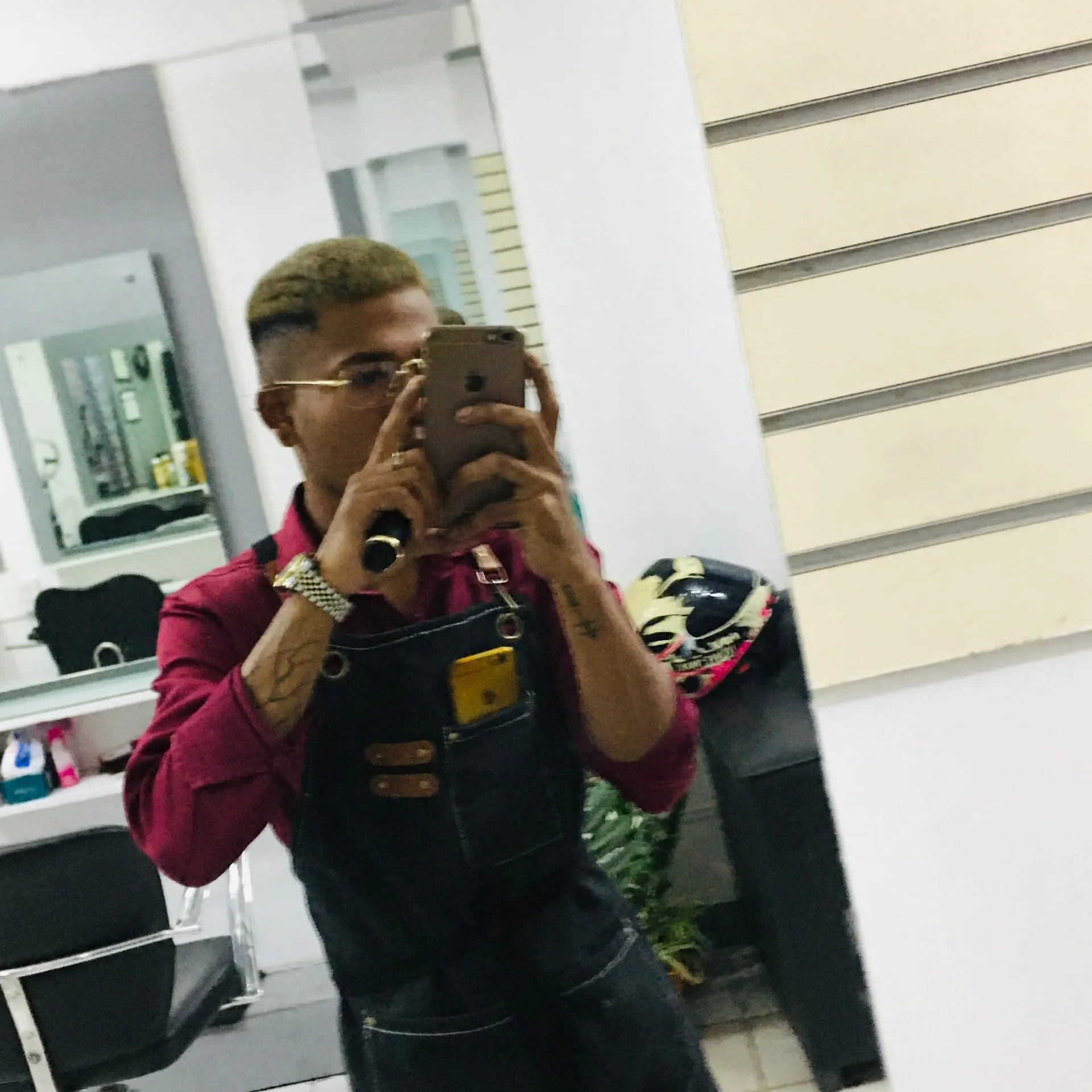 Charlie Domingo, owner and master barber, cutting hair at his Angeles City barbershop