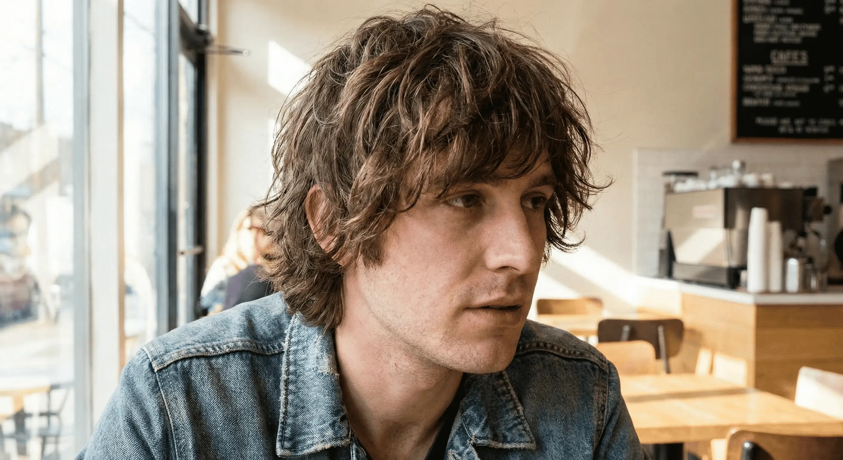 Close-up of a man with the layered shaggy mop haircut
