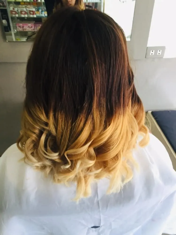 Classic men's fade haircut with clean sides and textured top