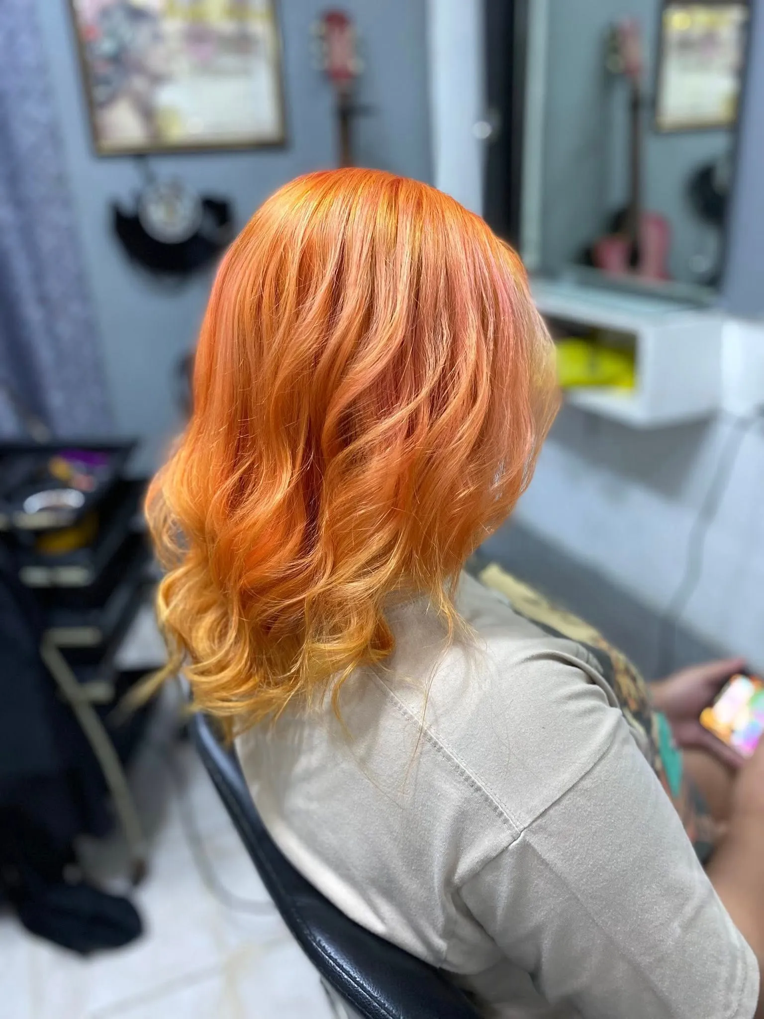 Men's orange highlight fade hairstyle at Charlie's Barbershop in Angeles City